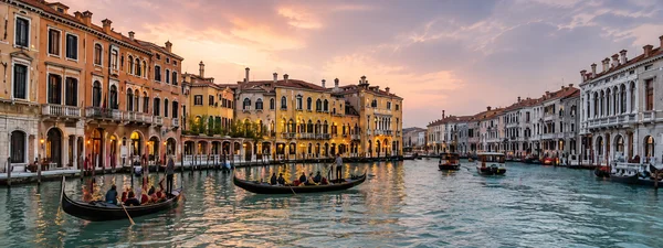 Gondolas on the Grand Canal in Venice at sunset, private chauffeur transfer to Venice