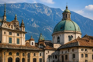 Como Cathedral and historic buildings in the centre of Como with the surrounding Alpine mountains.
