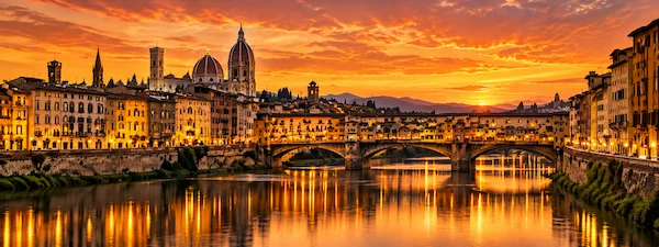 Florence skyline and Ponte Vecchio at sunset during a private transfer from Milan to Florence