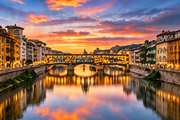 Ponte Vecchio in Florence at sunset during a private chauffeur transfer from Milan to Florence