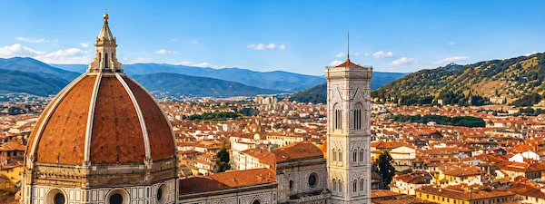 Florence Cathedral and Giotto’s Bell Tower with panoramic city view during a private transfer from Milan to Florence