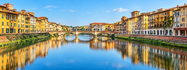 Arno River in Pisa with historic buildings and bridge
